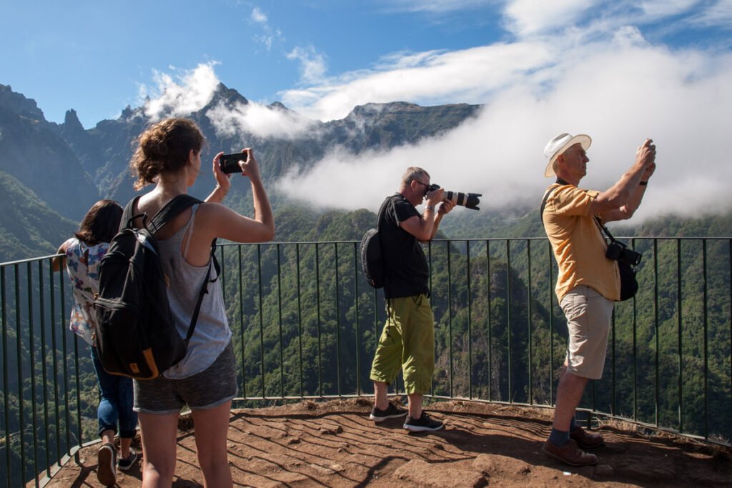 Visitors enjoying views at Levada dos Balcões, a short and scenic levada walk with mountain landscapes and birdlife in Madeira