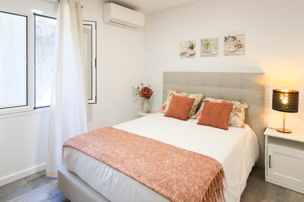 A classic bedroom with air conditioning in a house for living within nature in Madeira.