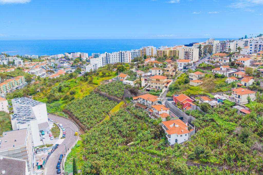 erial view of a residential plot of land for sale in Pilar Santo António with ocean views and proximity to Funchal city center