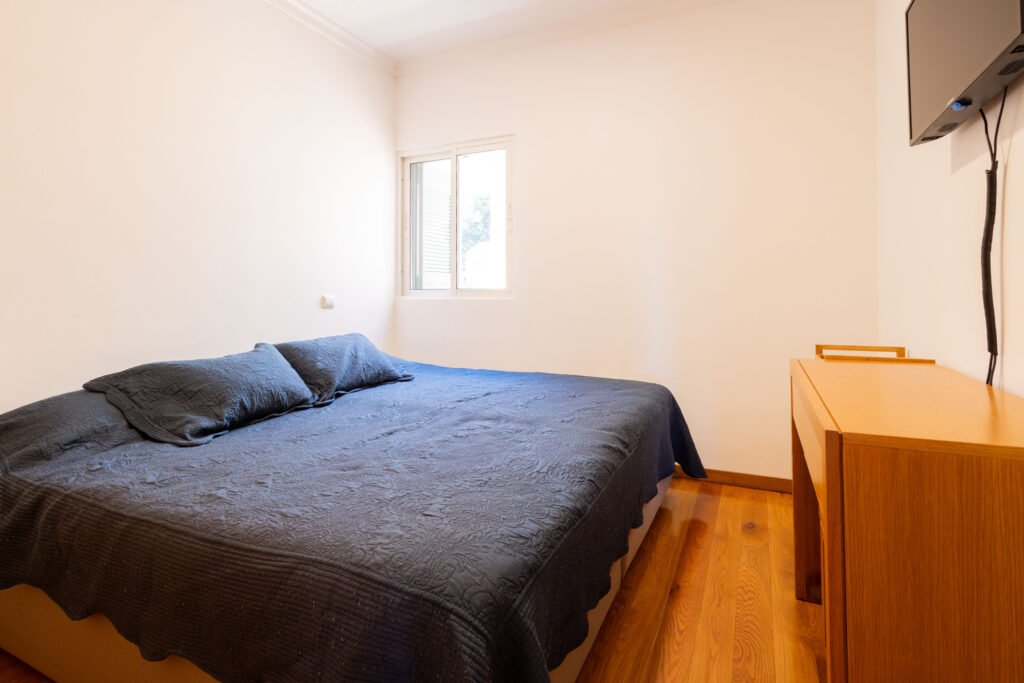 Second comfortable bedroom with wooden flooring in 3 bedroom duplex apartment Funchal