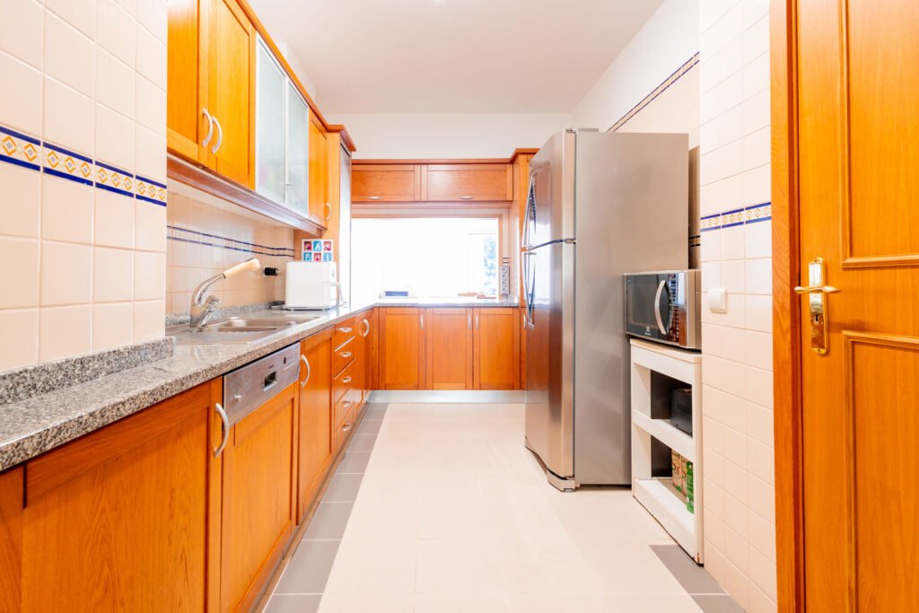 Fully fitted wooden kitchen with granite countertops in Funchal apartment investment property