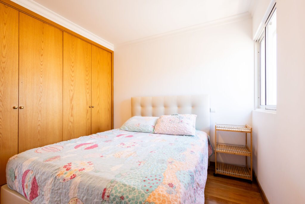 Third bedroom featuring built-in wooden wardrobes in Sao Martinho real estate property Funchal